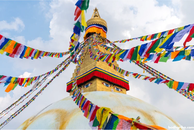 arafed view of a stupa with many colorful flags flying