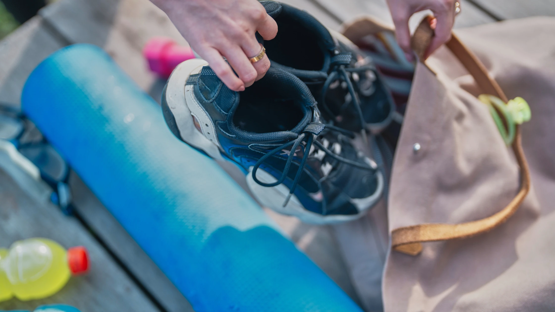 someone is putting a pair of shoes in a bag