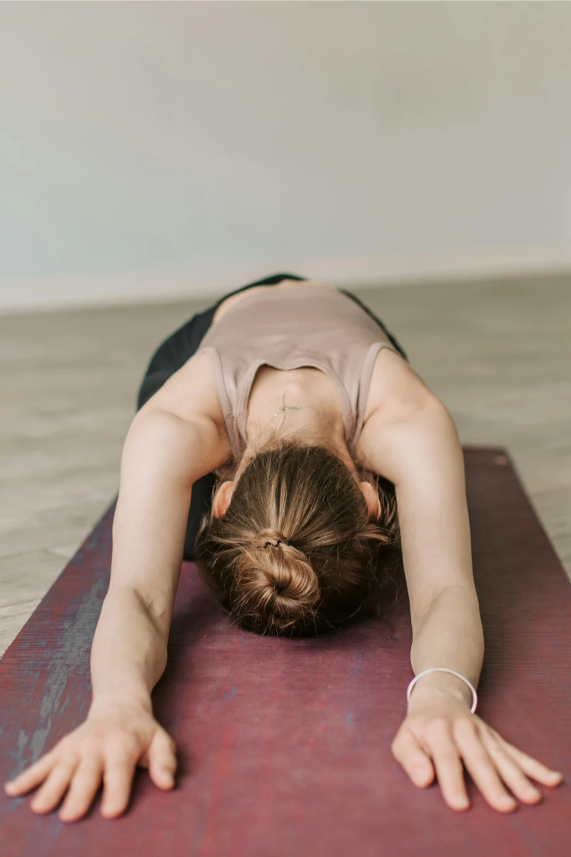 there is a woman doing a yoga pose on a