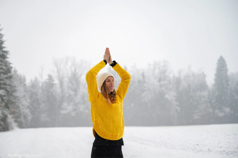 there is a woman in a yellow sweater and hat