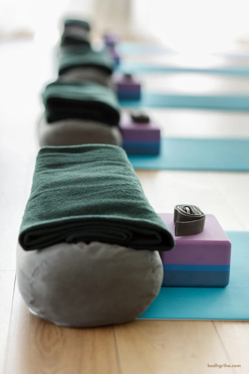 yoga mats lined up on a wooden floor with a